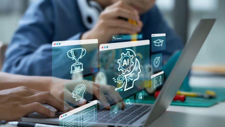 Students using a laptop with digital AI and cybersecurity icons floating above the screen, symbolizing artificial intelligence in K-12 education technology.