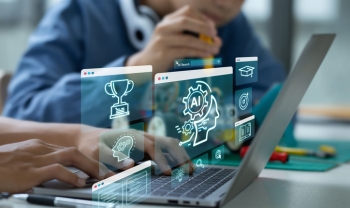 Students using a laptop with digital AI and cybersecurity icons floating above the screen, symbolizing artificial intelligence in K-12 education technology.