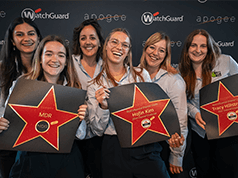 WatchGuard women holding red star awards